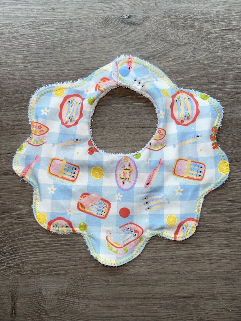 Kids Floral Edge Bib in Light Blue Check Pattern